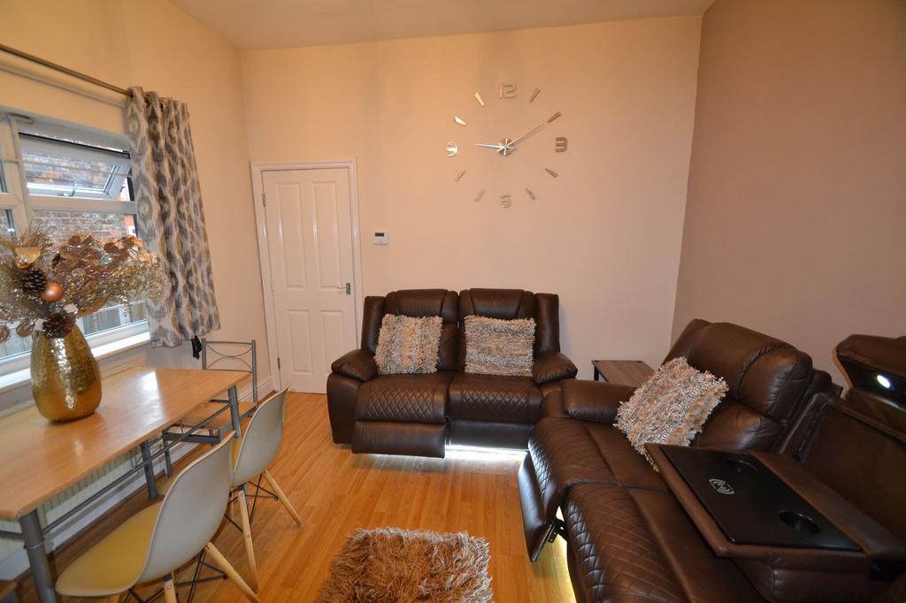 Bright, modern living room with comfortable bro...