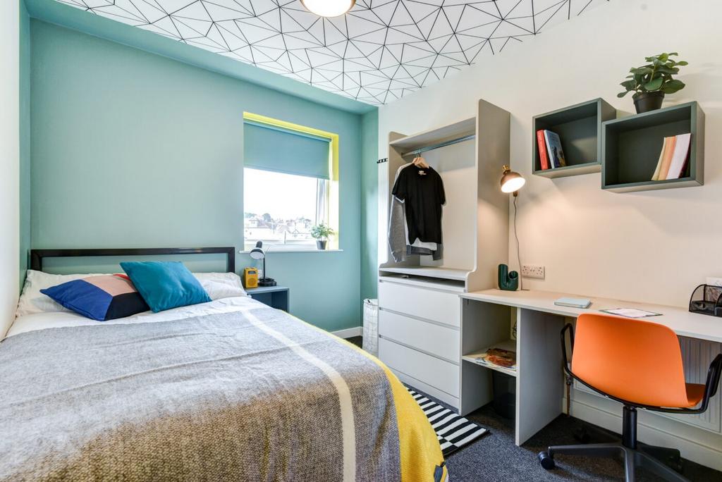 Bright, modern bedroom with a comfortable doubl...