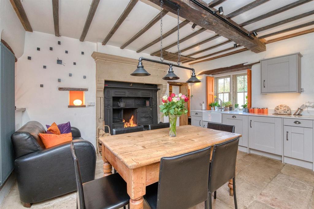 Dining Room - table, stove and shuttered window.jp