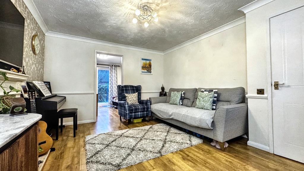 Bright, modern living room with wood flooring, ...