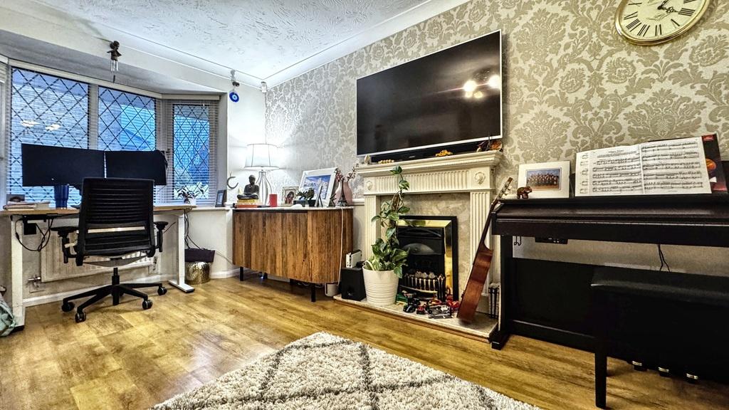 Bright, stylish living room with wood flooring,...