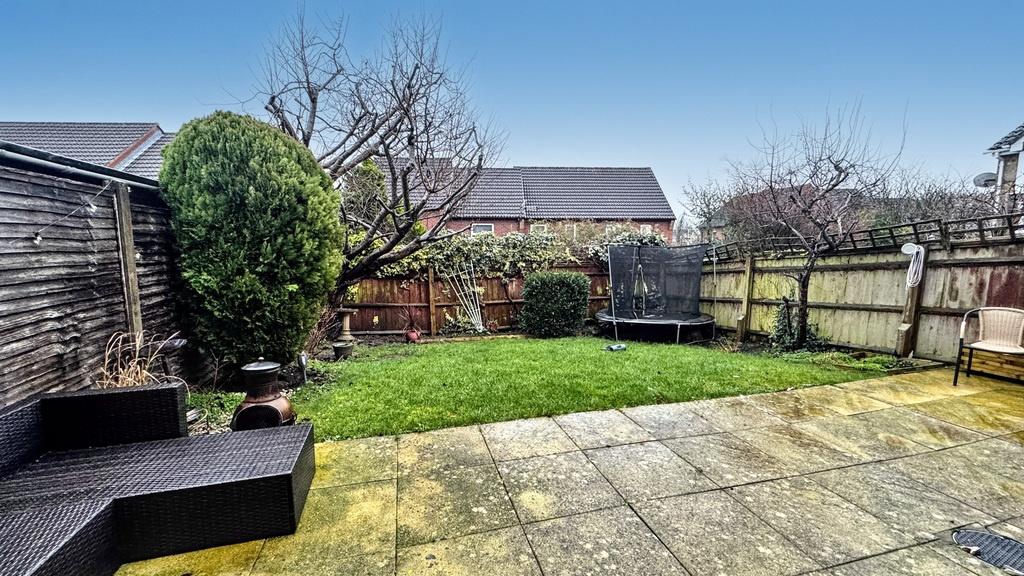 Well-maintained private rear garden with paved ...