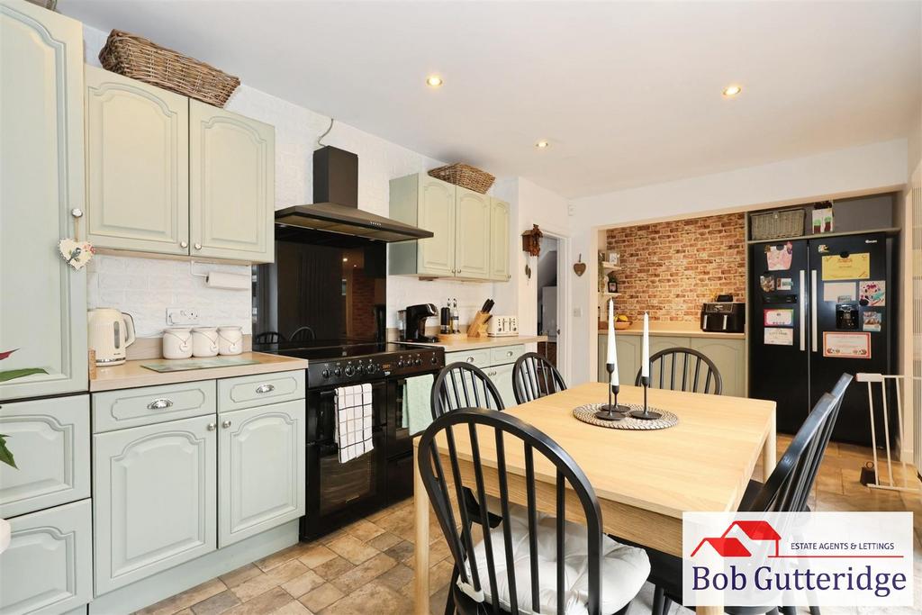 Open plan fitted kitchen / dining room