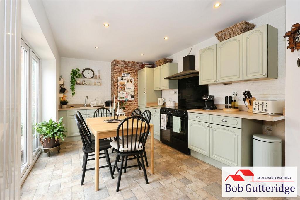 Open plan fitted kitchen / dining room
