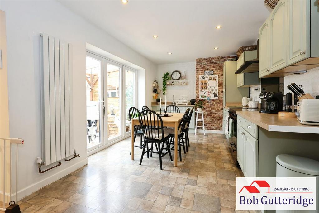 Open plan fitted kitchen / dining room