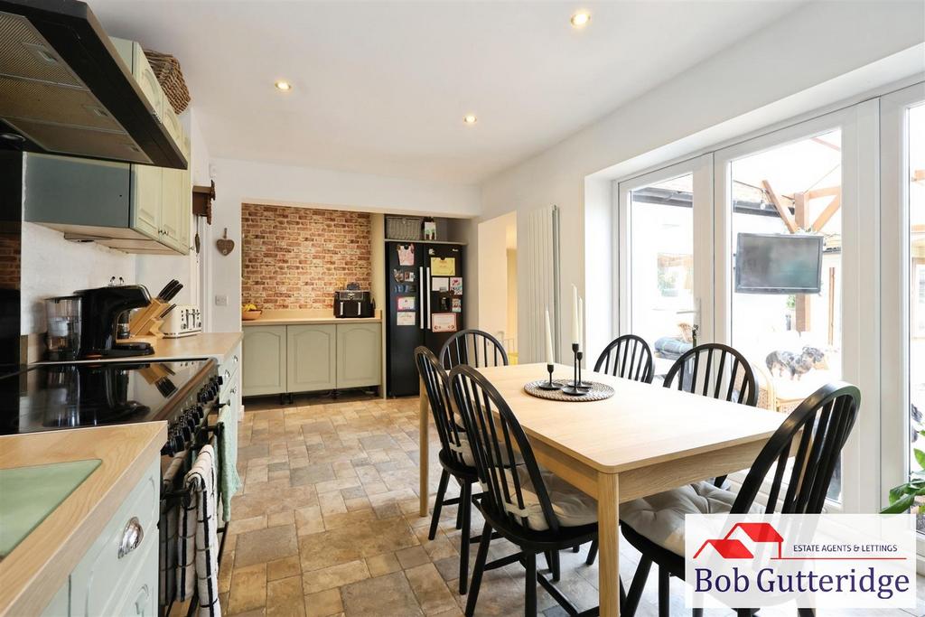 Open plan fitted kitchen / dining room