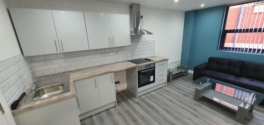 Modern open-plan kitchen and seating area with ...