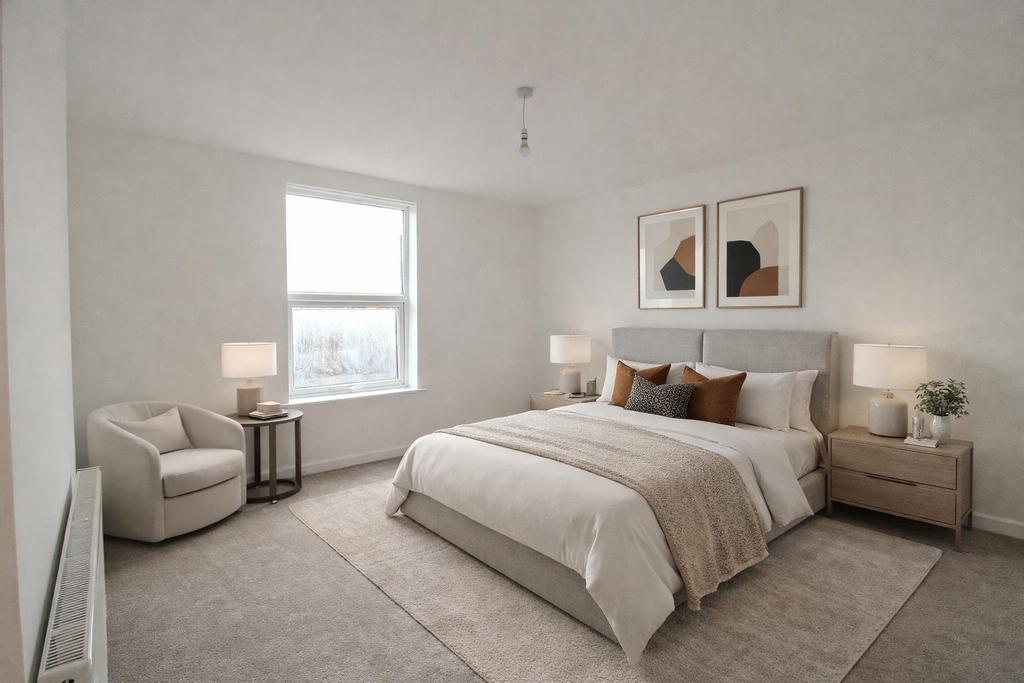 Modern neutral bedroom with armchair.png