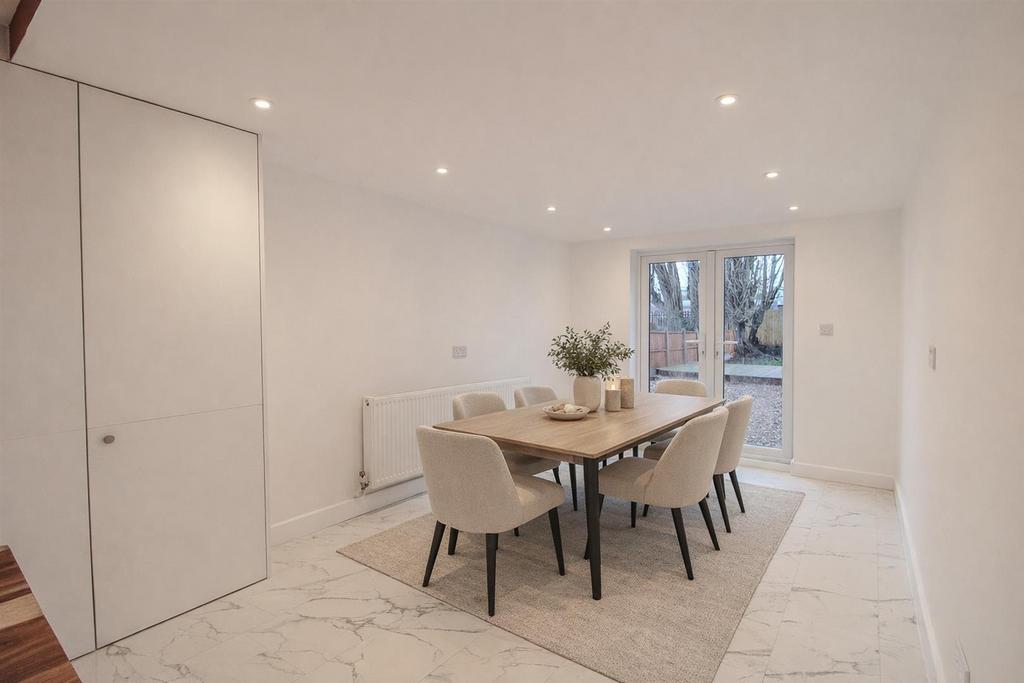 Modern dining with green accents.jpg