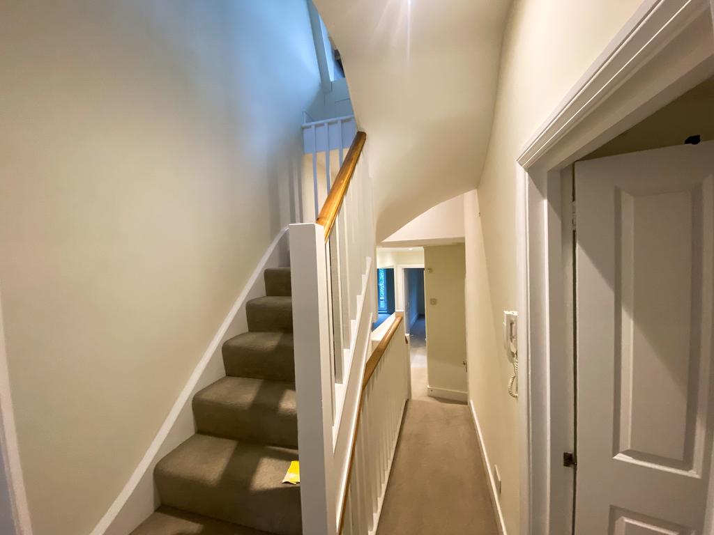 Stairs to reception and kitchen