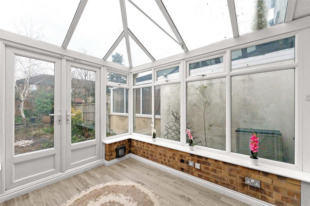 Conservatory interior, conservatory, french doors leading to garden