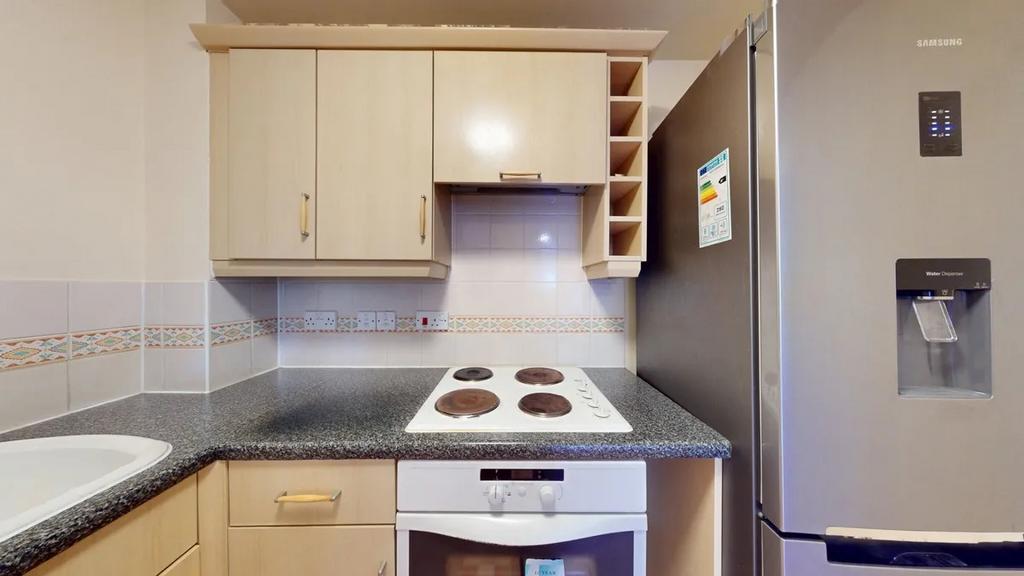 Modern fitted kitchen with laminate worktops, i...