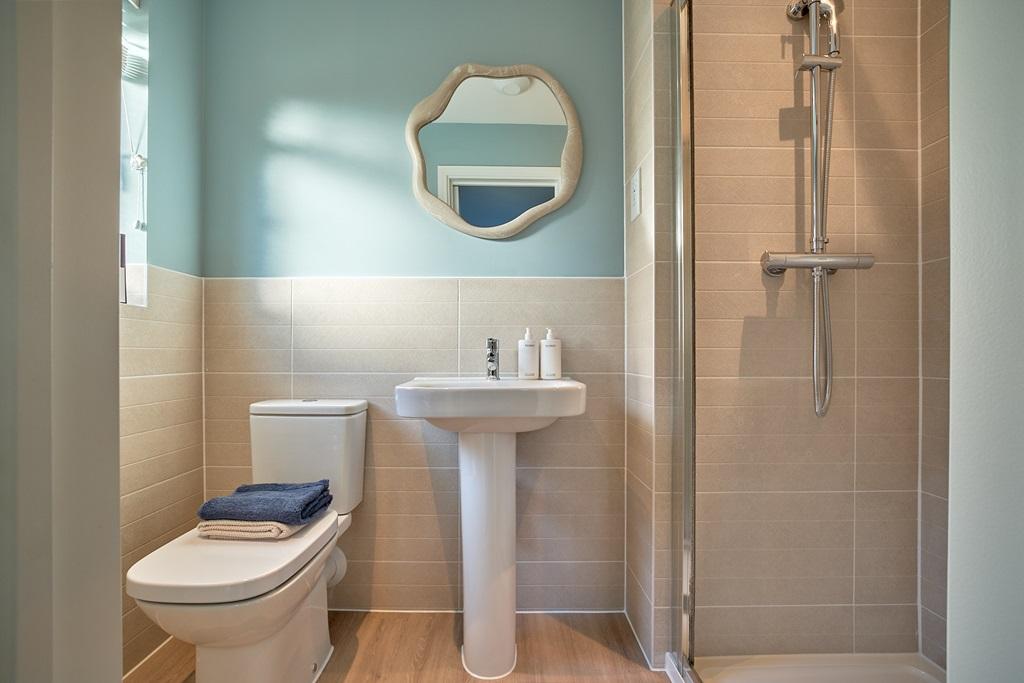 The en-suite with high quality fixtures and...