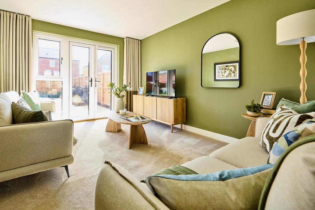 The living room is spacious with space for the...