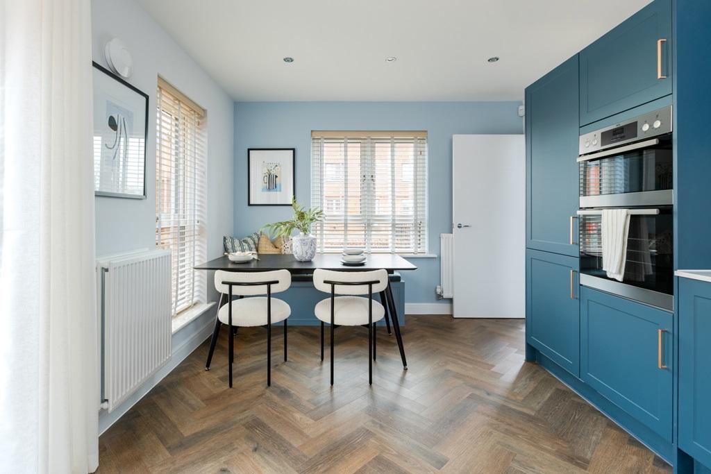 Dual aspect windows flood the dining space with...