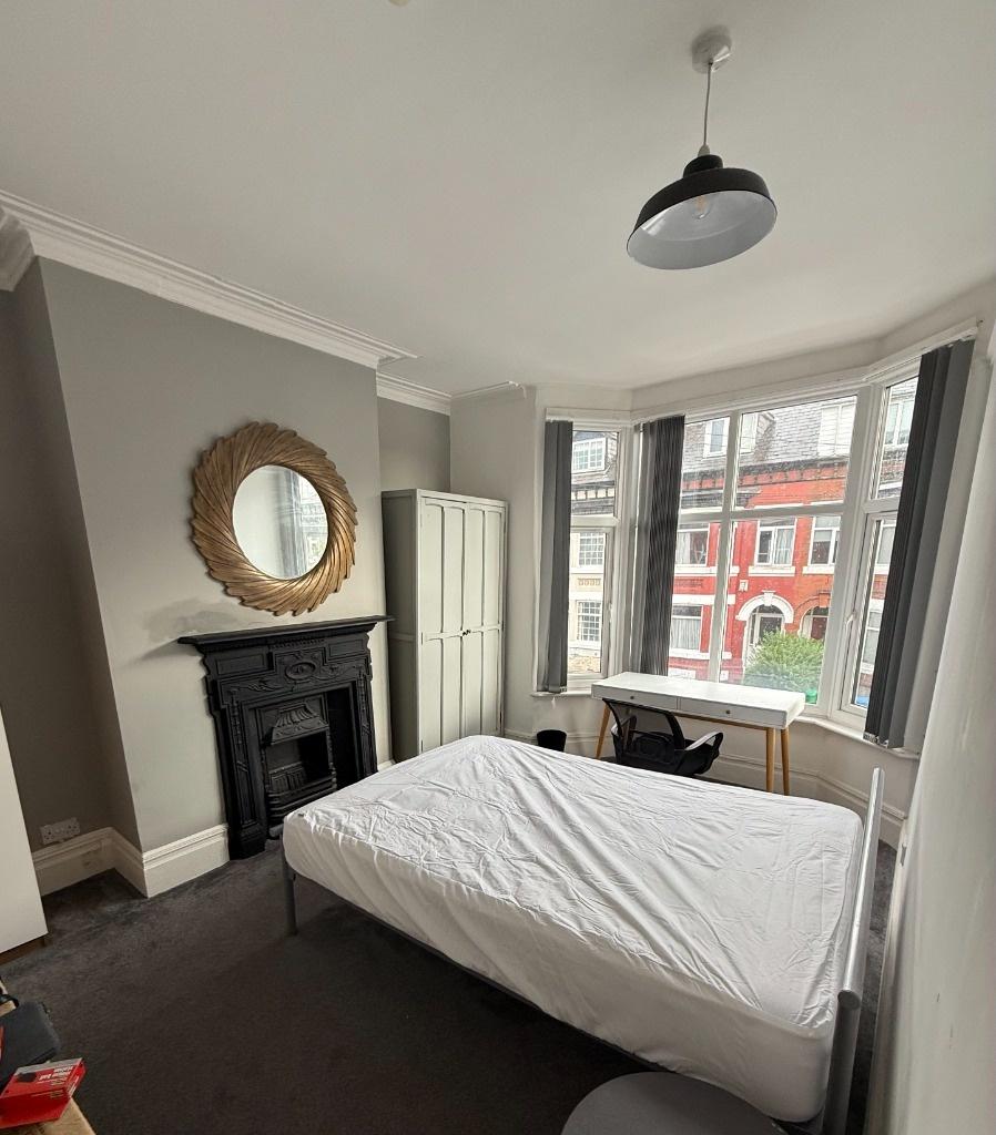 Bright, well-presented bedroom with a bay windo...