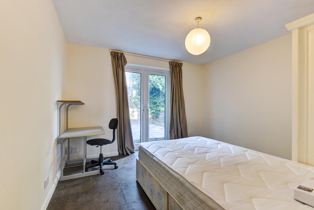 Spacious master bedroom featuring a comfortable...