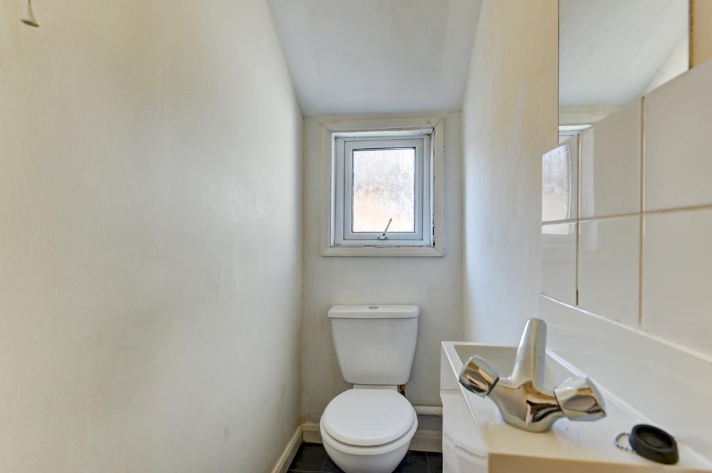 A clean and functional bathroom with a toilet a...