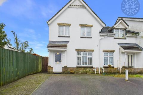 'Three-bedroom end-terrace home with parking, arranged over 756 sq. ft.'