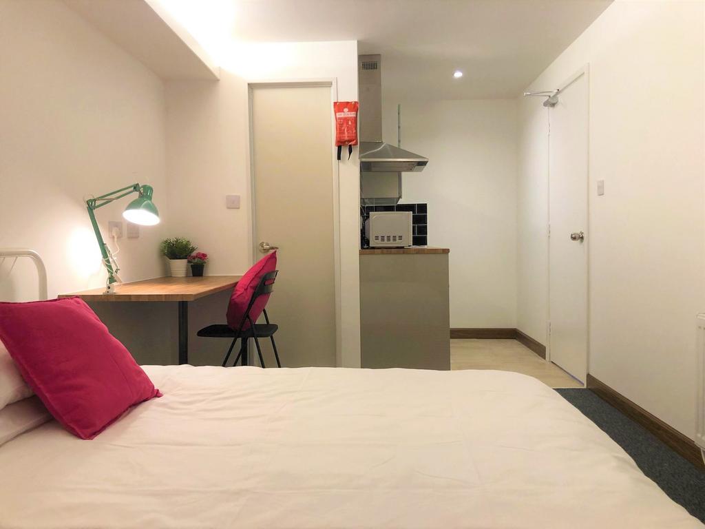 Bright and tidy double bedroom featuring a comf...