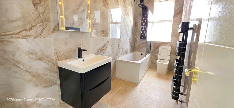 A modern and clean bathroom featuring a sleek b...