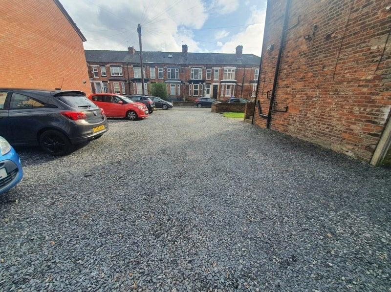 A spacious view of the front vehicle parking ar...