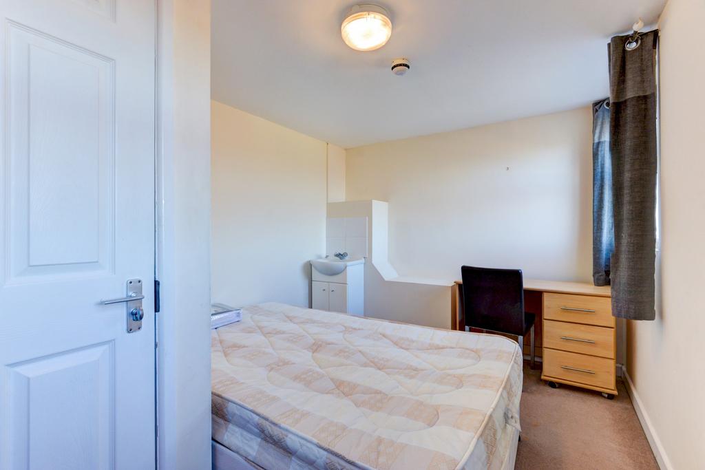 Well-presented bedroom with a double bed, built...