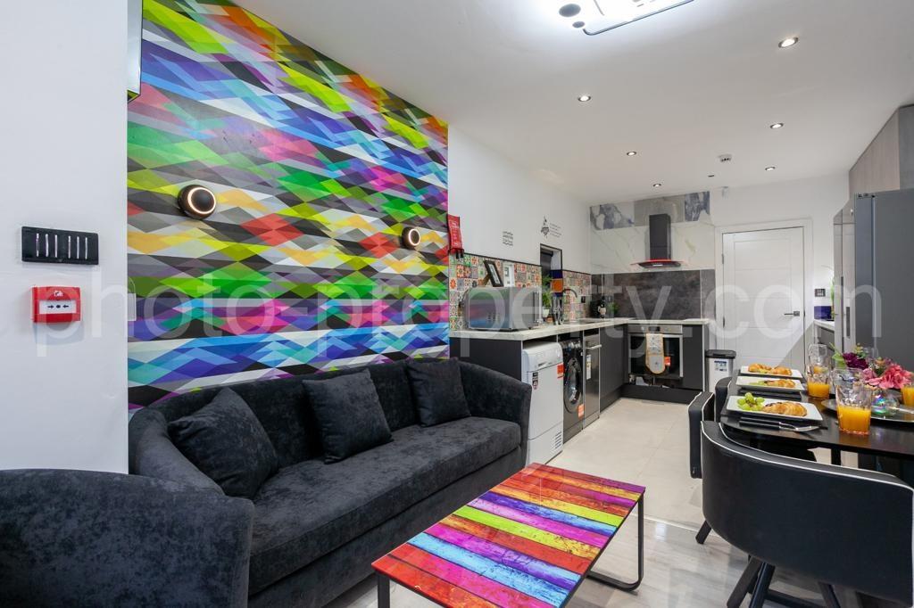 Bright, modern open-plan living area with a col...