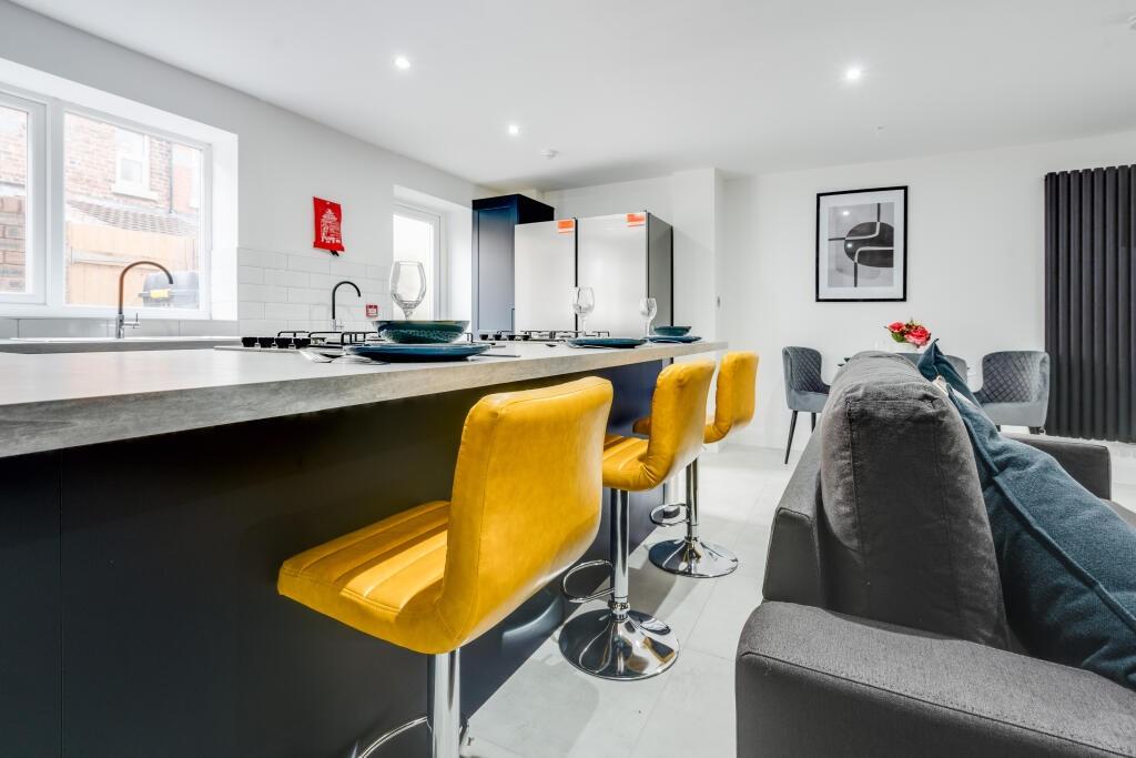 A modern and stylish living room featuring a la...