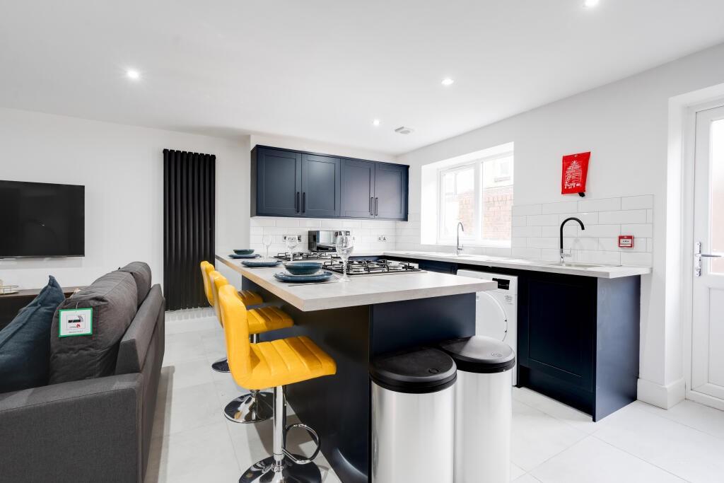 Modern and bright kitchen with ample counter sp...