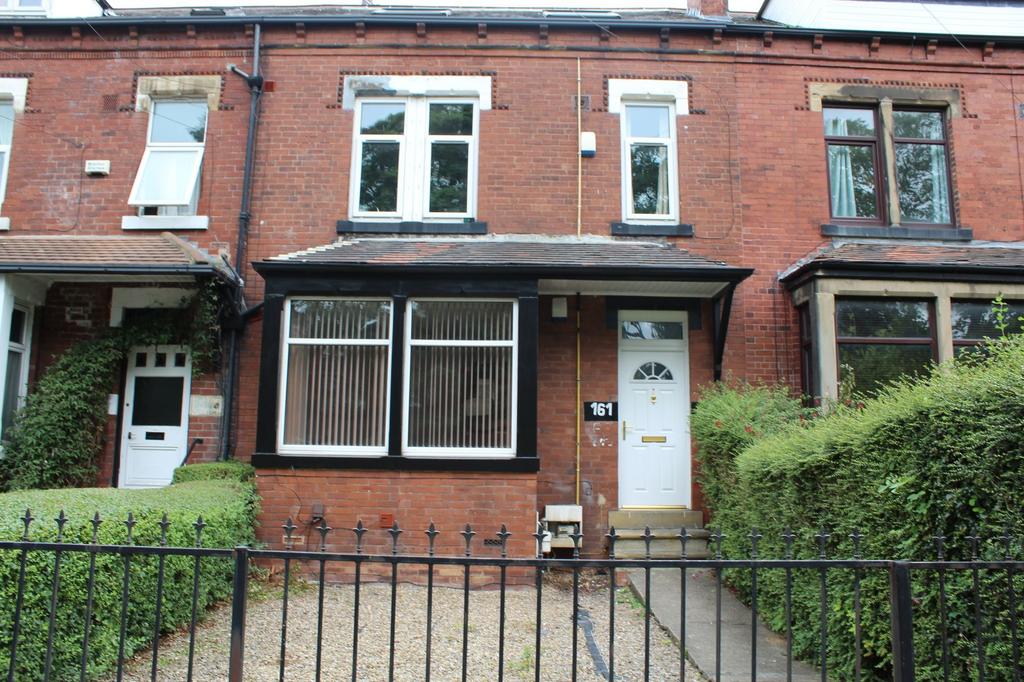 A charming brick-fronted house with a welcoming...