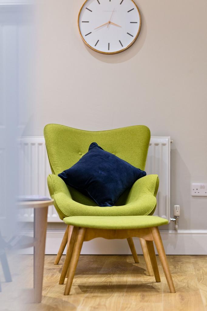 Bright, stylish seating corner with a modern gr...