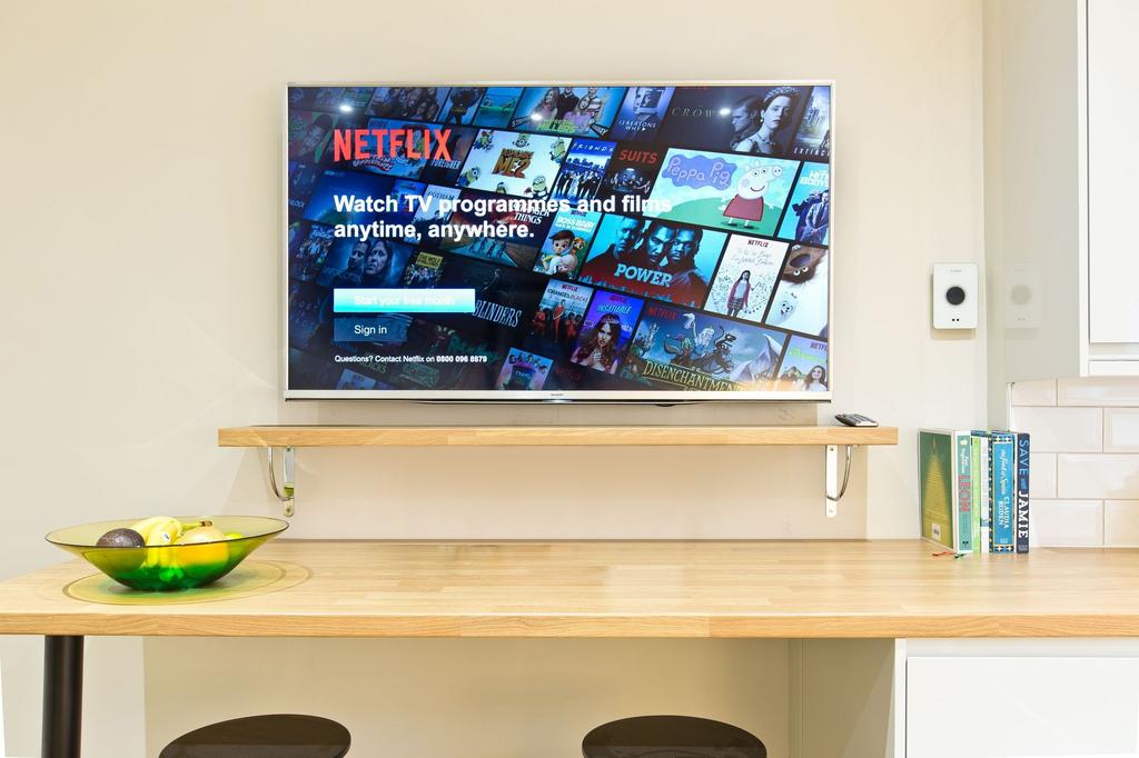 Bright, modern kitchen nook with a wall-mounted...