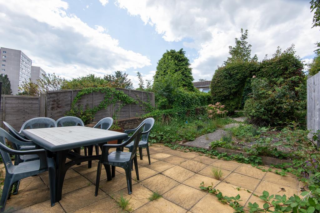 Private rear garden with paved patio and seatin...