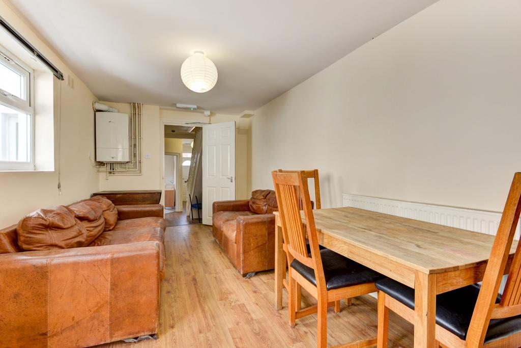 A spacious and welcoming living room featuring ...