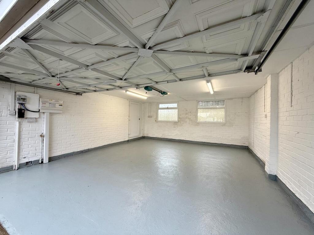 Double garage and drive