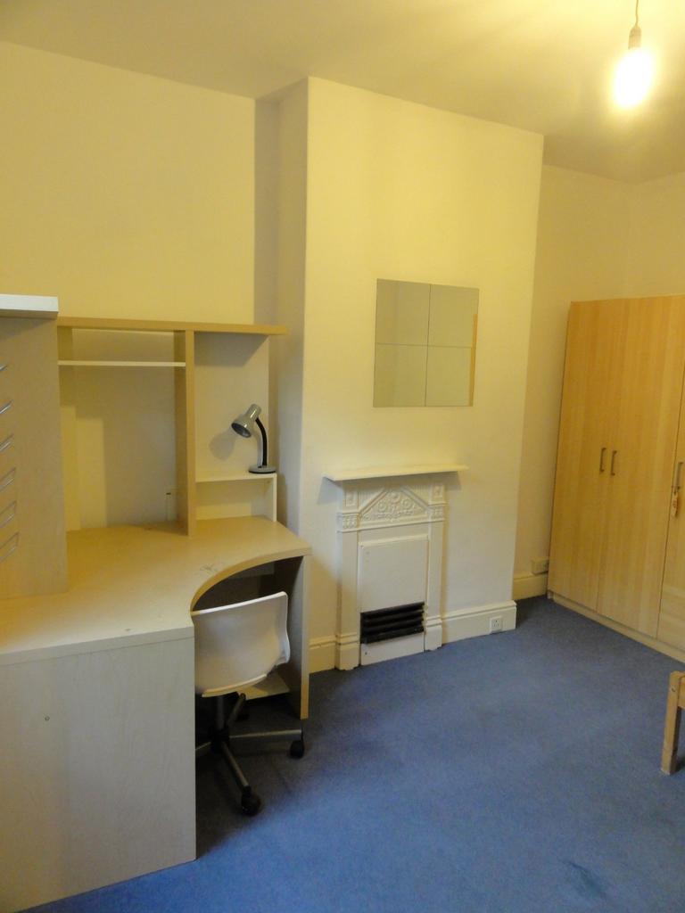 Well-presented bedroom with an integrated corne...