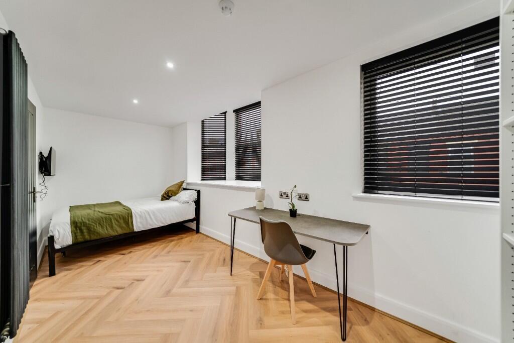 A modern and spacious living room flooded with ...