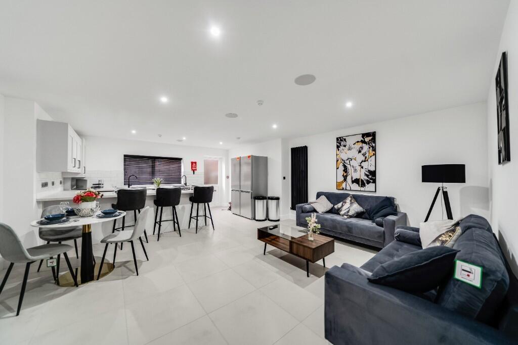 A spacious and modern living room with bright n...