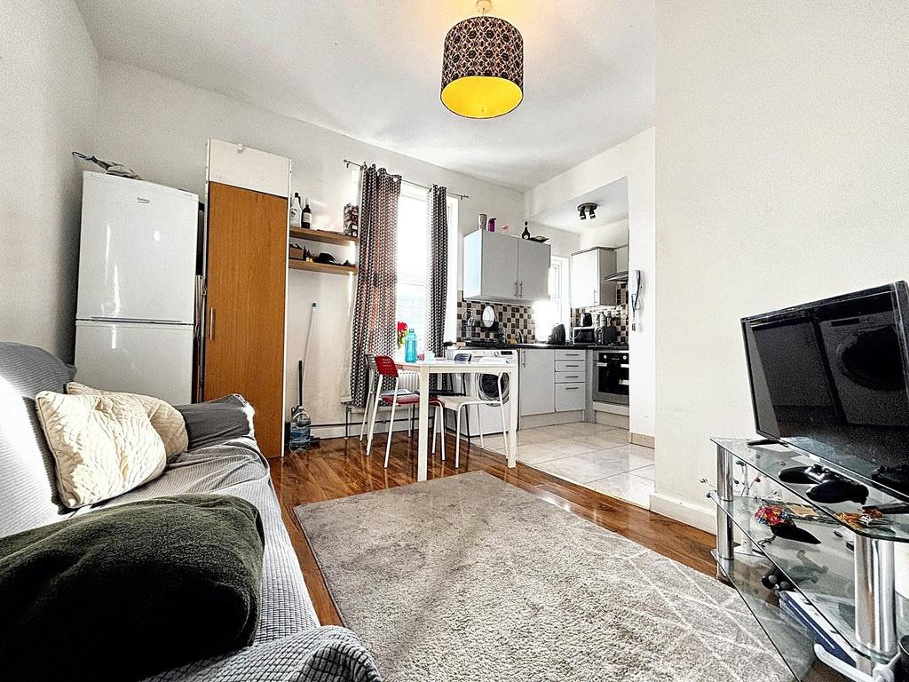 Bright, open-plan living area with a comfortabl...