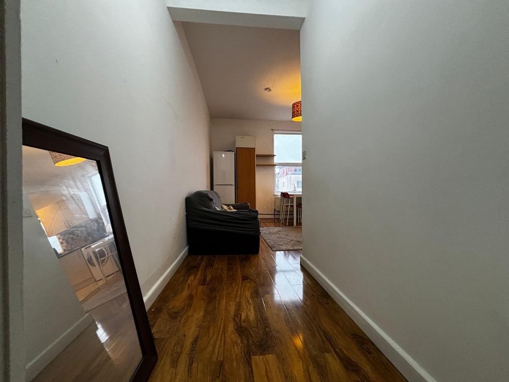 Bright, recently painted hallway with glossy wo...