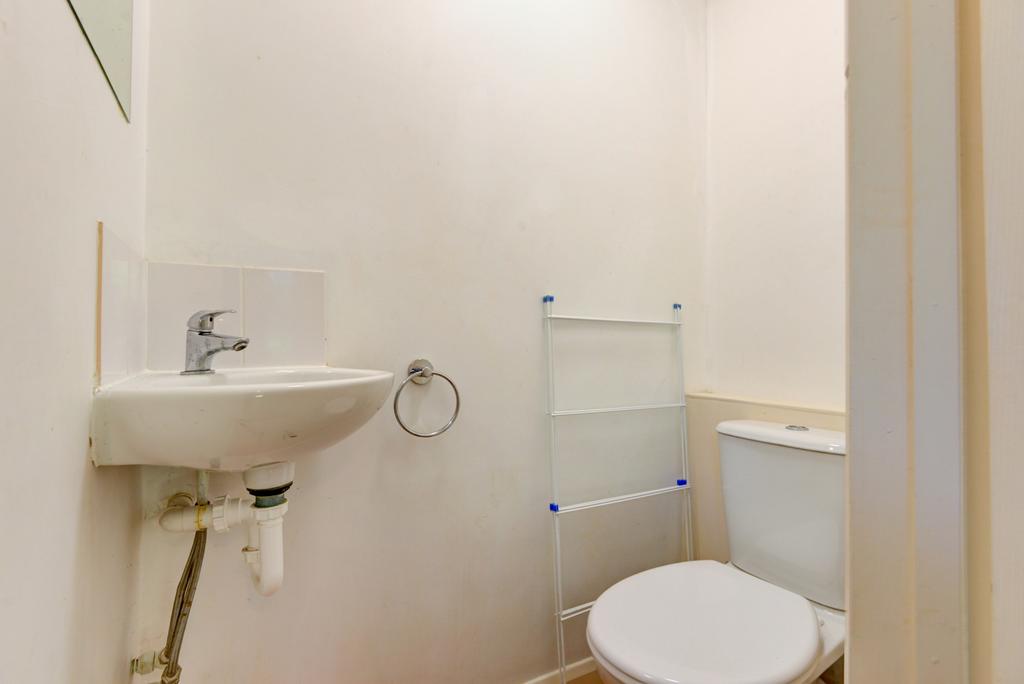 A clean and functional bathroom with a toilet a...