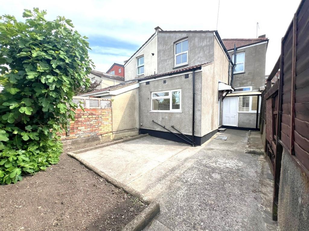 Well-maintained rear exterior area with paved s...