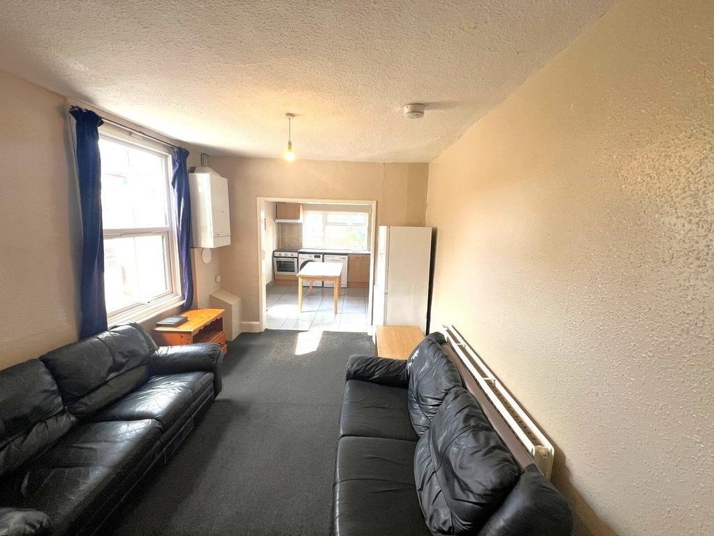 Bright, open-plan living area with large front ...
