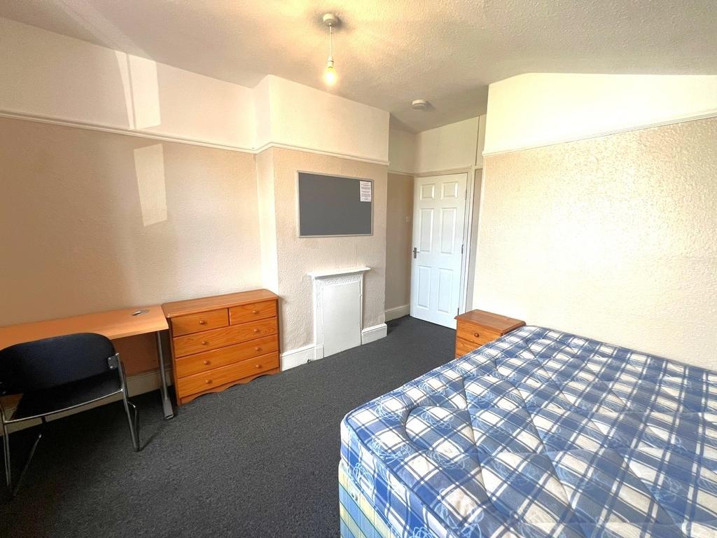 Bright double bedroom with a large double bed, ...
