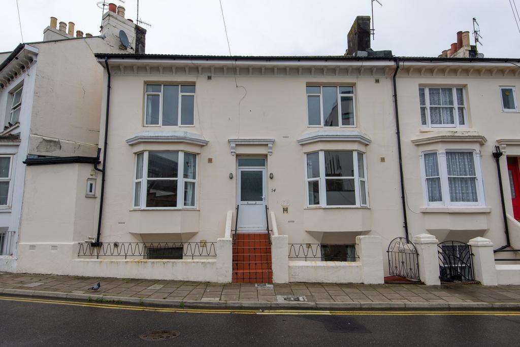 A charming front view of a traditional terraced...