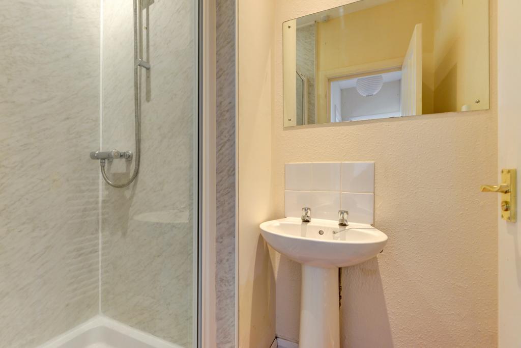 A clean and well-maintained bathroom featuring ...