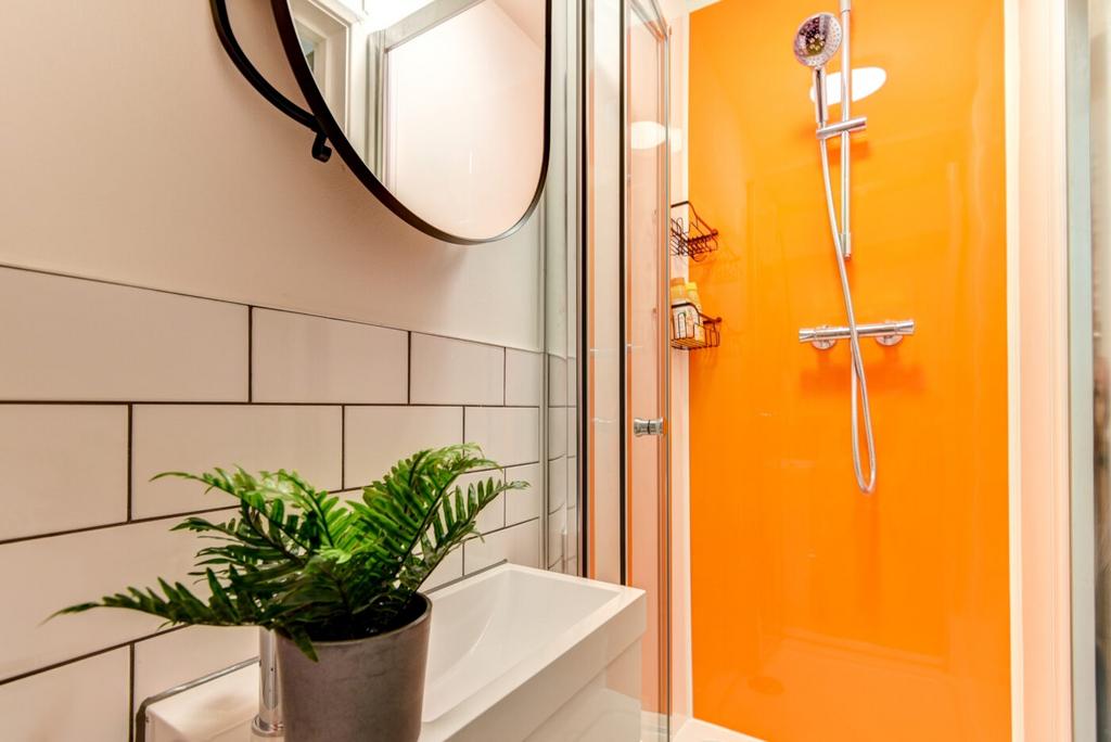 Bright and contemporary bathroom featuring a vi...