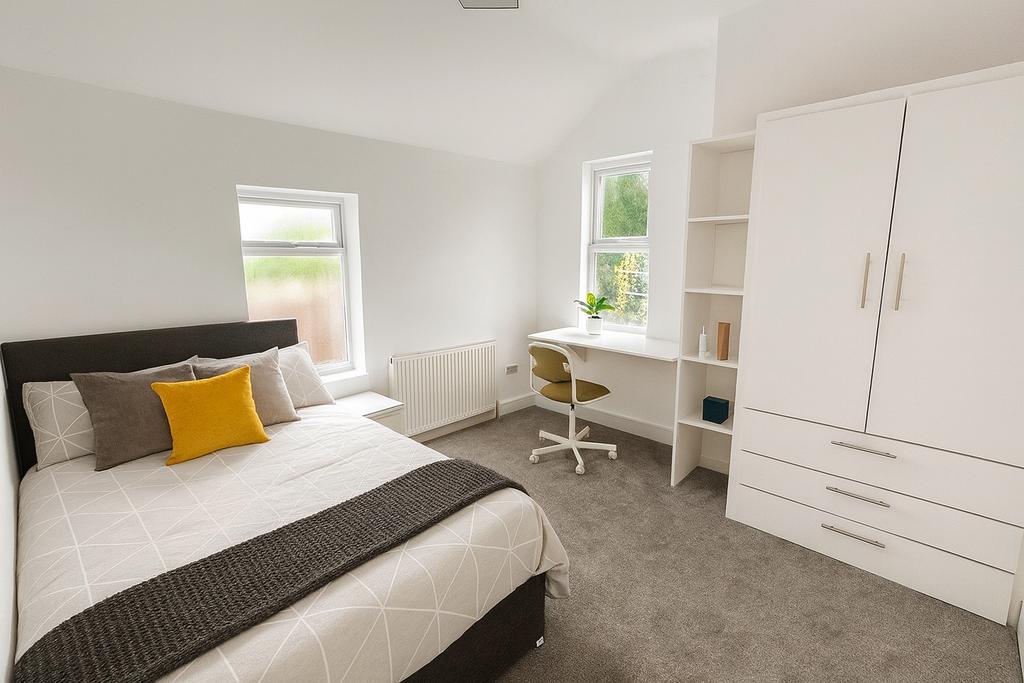 Bright, modern double bedroom with a comfortabl...
