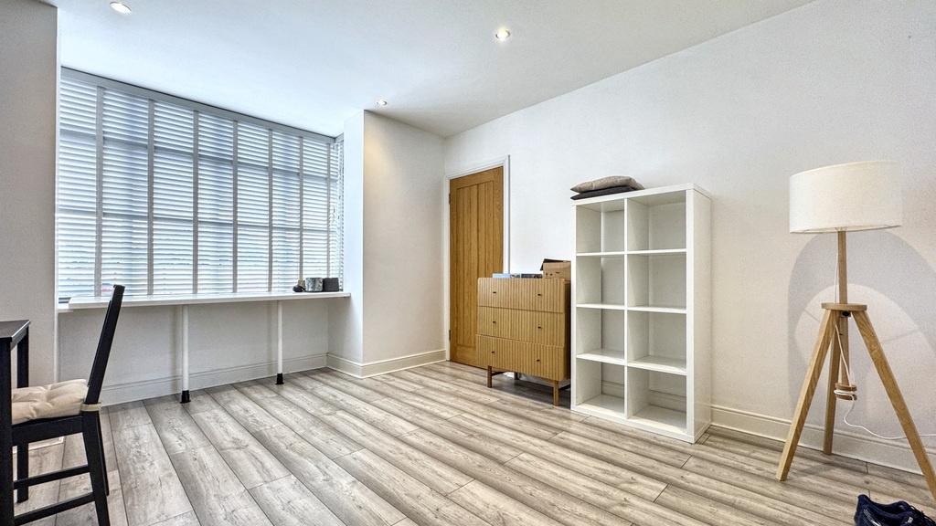 Bright, modern communal workspace with large in...